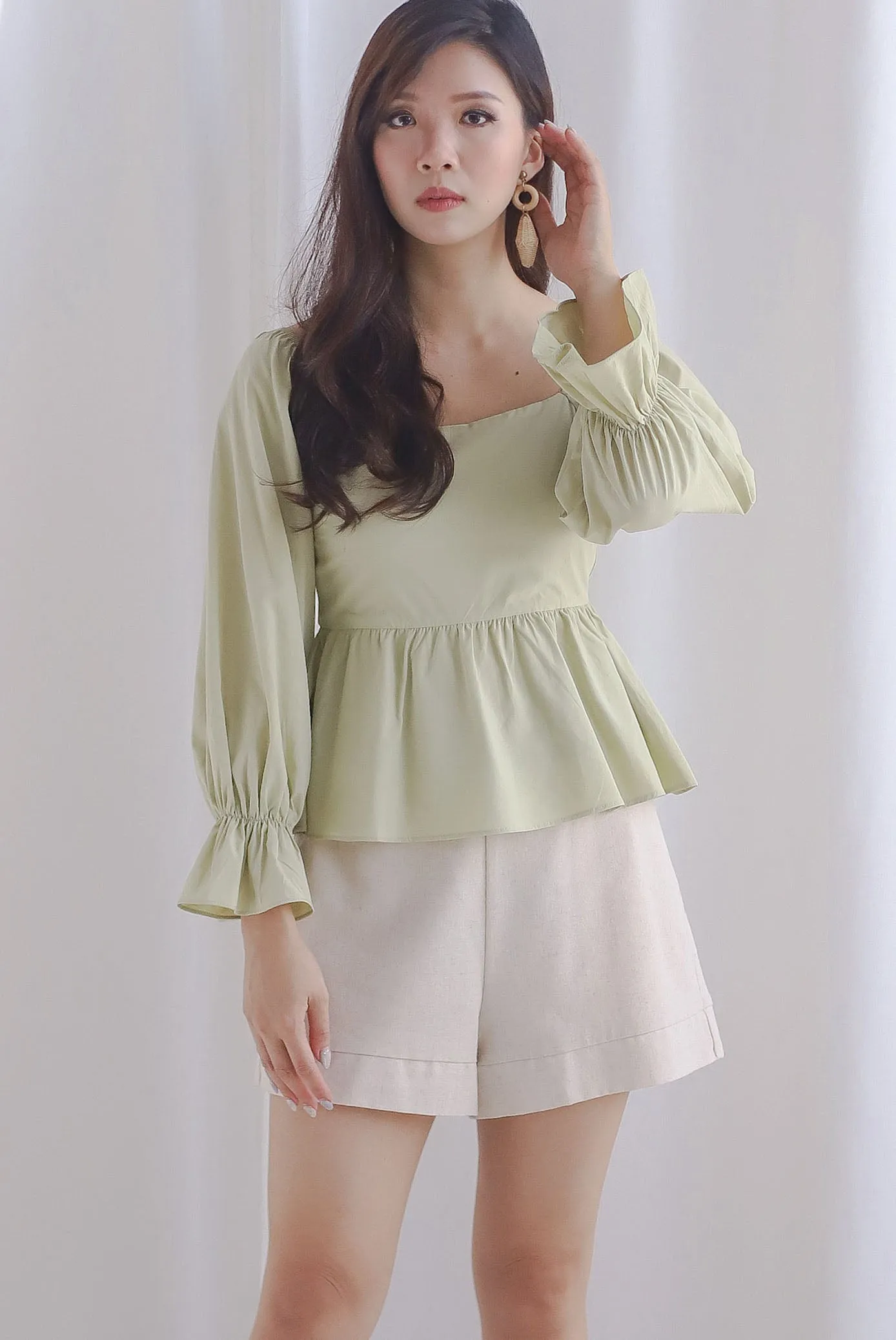 Santino Puffy Sleeve Square Neckline Peplum Top In Pistachio