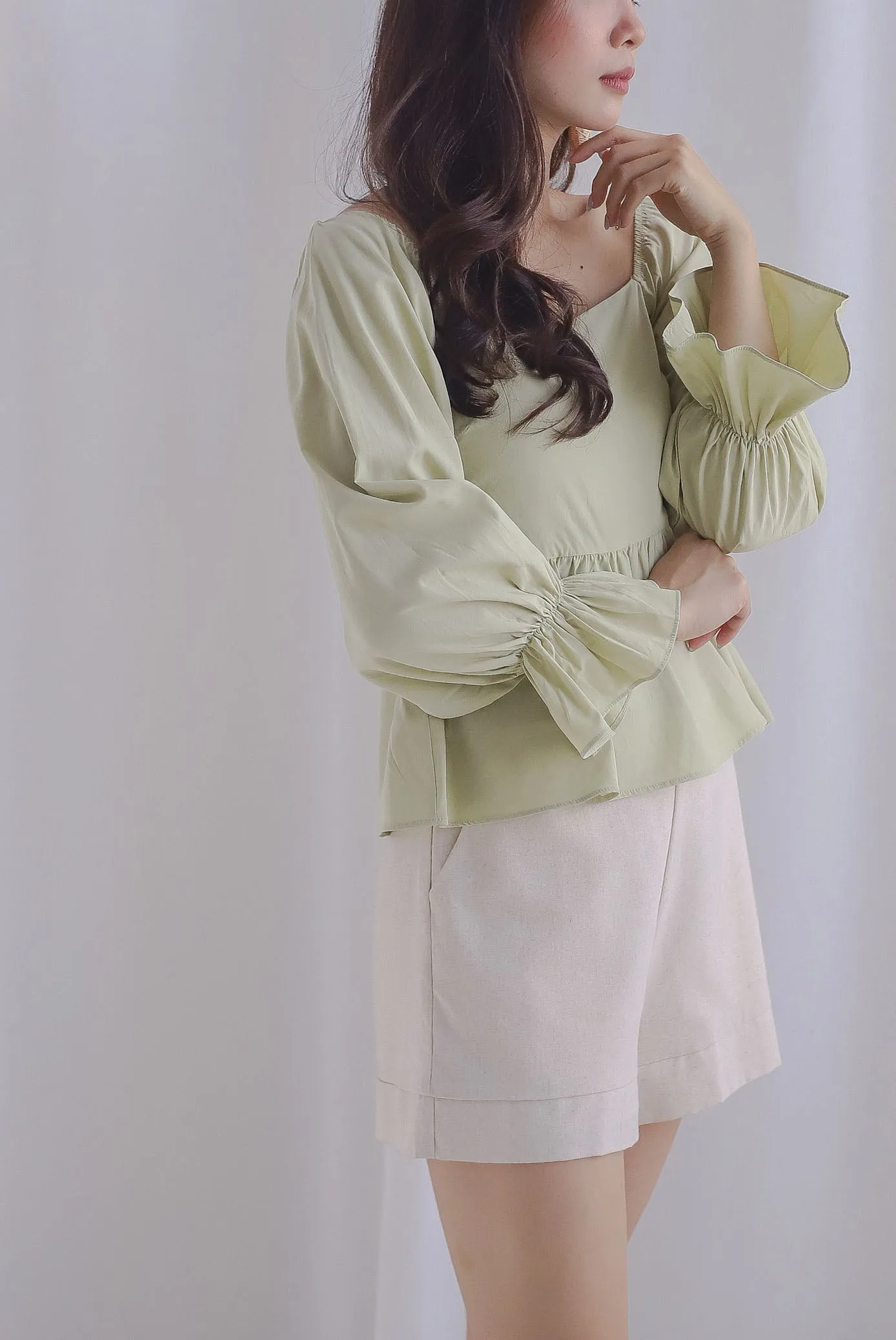 Santino Puffy Sleeve Square Neckline Peplum Top In Pistachio